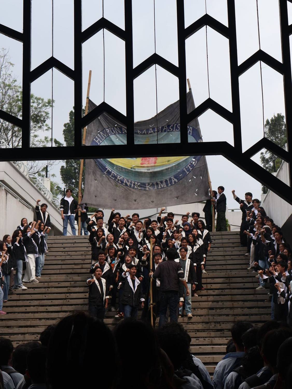ITB campus staircase architecture with a crowd of students