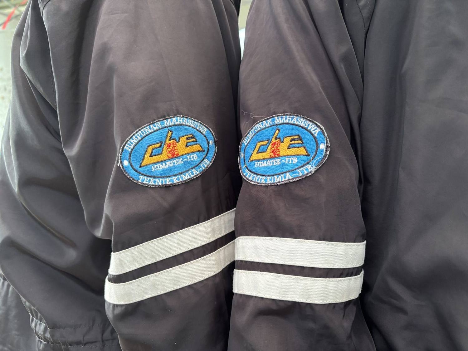 Backs of association jackets with the ChE emblem